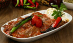 Turkish Iskender kebab with yoghurt and french fries